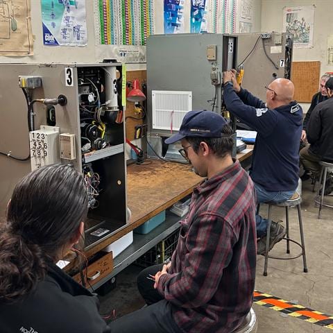 Wide classroom overview during a live HVAC class session