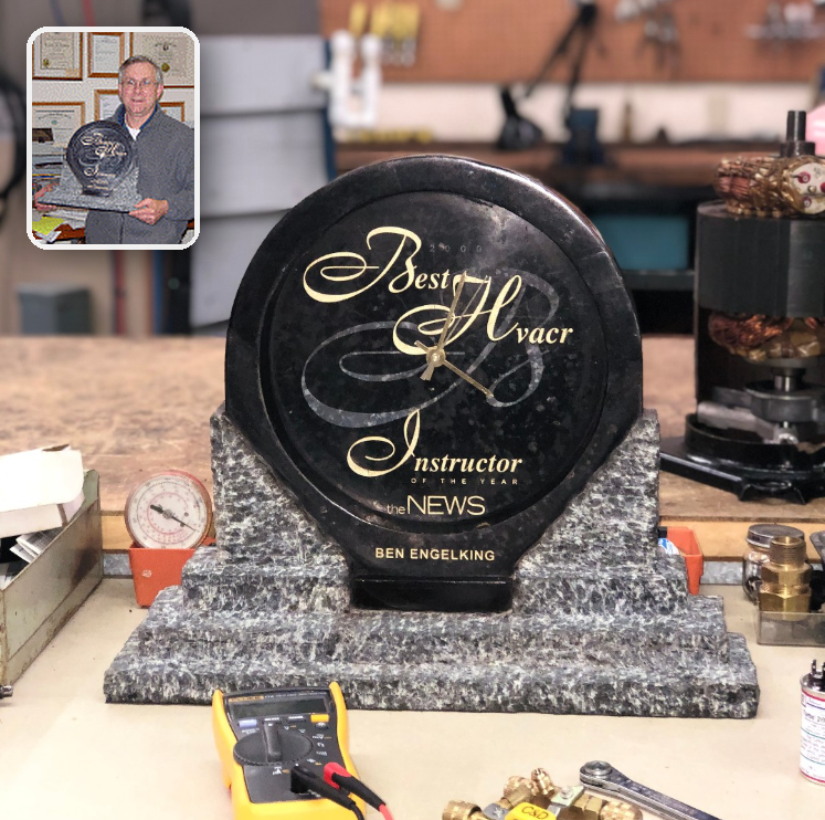 Best HVAC Instructor of the Year award on a workbench with a small inset portrait of Ben Engelking in the upper left